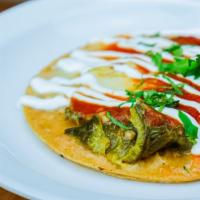 Chile Relleno Tako · Poblano pepper stuffed with cheese topped with tomato sauce, sour cream, and cilantro.