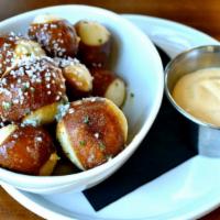 Pretzels Bites W/Beer Cheese Sauce · Warmed in our wood fired oven with garlic butter and sprinkled with pretzel salt. Served wit...