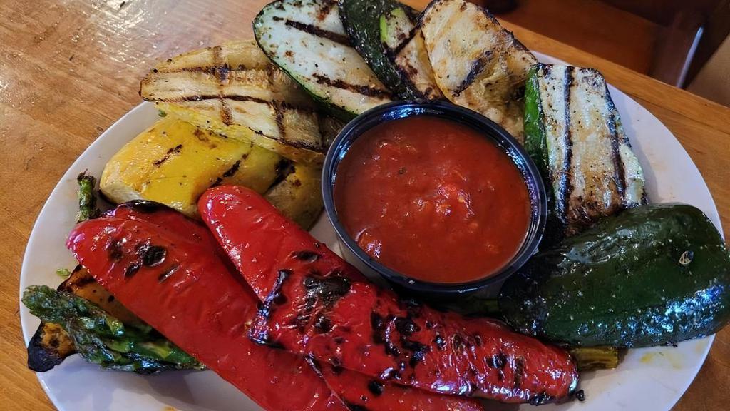 Veggie Plate (Grilled) · Light, healthy and so vibrant! Turning into a very popular appetizer, this plate does take a little extra time to prepare. Asparagus, red peppers, zucchini and yellow squash are lightly brushed with olive oil and seasoned with a blend of spices and then grilled to perfection. Served with our homemade marinara sauce.