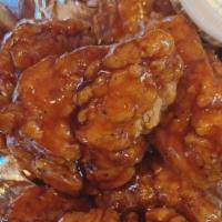 Wings, Boneless · Boneless pieces of breast meat that is battered then deep fried to a crispy golden brown. Se...