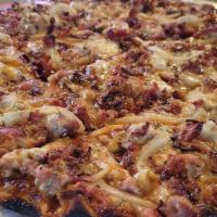 The Western Pizza · BBQ sauce base topped with sausage, mozzarella cheese, onions and bacon. Both sweet and savo...