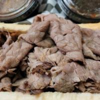 Italian Beef · A long time Chicago staple, we start our beefs with lean cuts of roast beef. We  marinate ou...