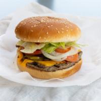 Cheeseburger · Prepared as our tasty 1/4 pound hamburger with melted American cheese. Grilled onions are op...