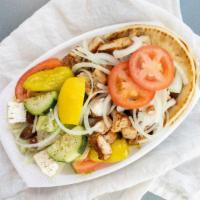 Chicken Shish Kabob · Small pieces of marinated chicken breast served on pita bread with fresh onions and tomatoes...