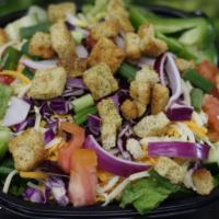 Garden Salad · Served with Mixed Greens, Red Onion, Green Pepper, Tomatoes & Cucumbers