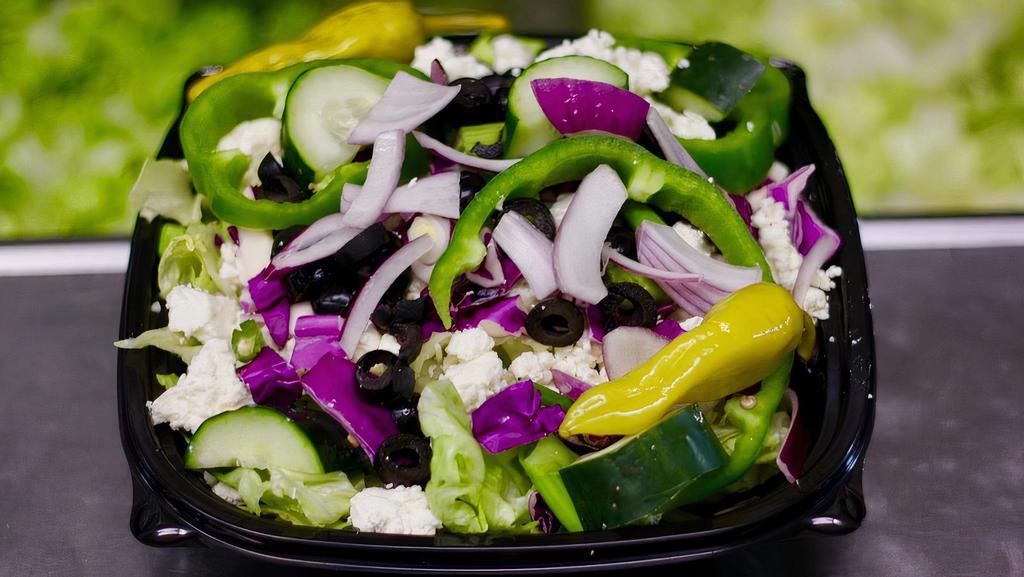 Greek Salad · Romain and iceberg lettuce, green peppers, red onions, red cabbage, kalamata olives and Feta cheese.