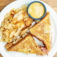 Monte Cristo · Texas toast dredged in French toast batter and grilled, Swiss cheese, turkey and ham, then s...