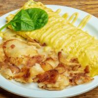 Spinach Omelette · A country size omelette filled with fresh spinach leaves, tomatoes, onions, bacon and Monter...