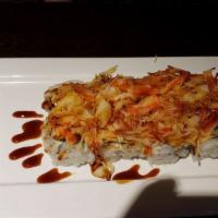 Volcano Roll · White tuna, super white tuna, cream cheese, avocado topped with toasted crabmeat, toasted sc...