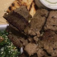 Greek Dinner · Gyros meat, humous, tabouli, tzatziki sauce, and drink.