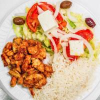 Chicken & Rice Dinner · Grilled chicken, rice, salad, tzatziki sauce, feta cheese, and drink.