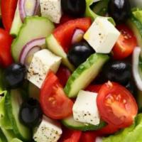 Greek Salad · Lettuce, tomatoes, onions, olives, feta cheese, tzatziki sauce, whole pita bread.