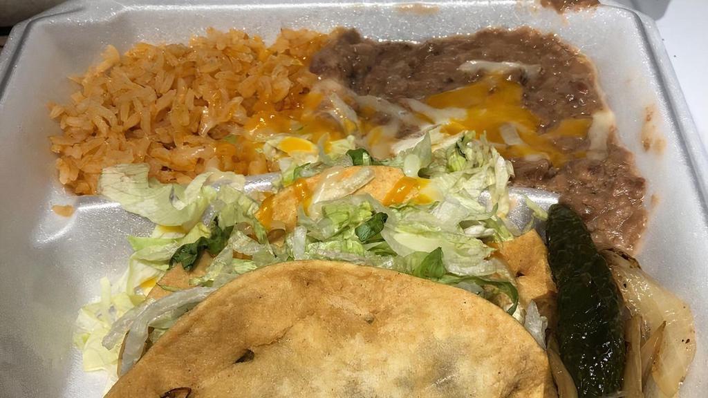 3# Beef Tacos Combo (2 Pieces) · Two beef tacos and side of beans and rice.