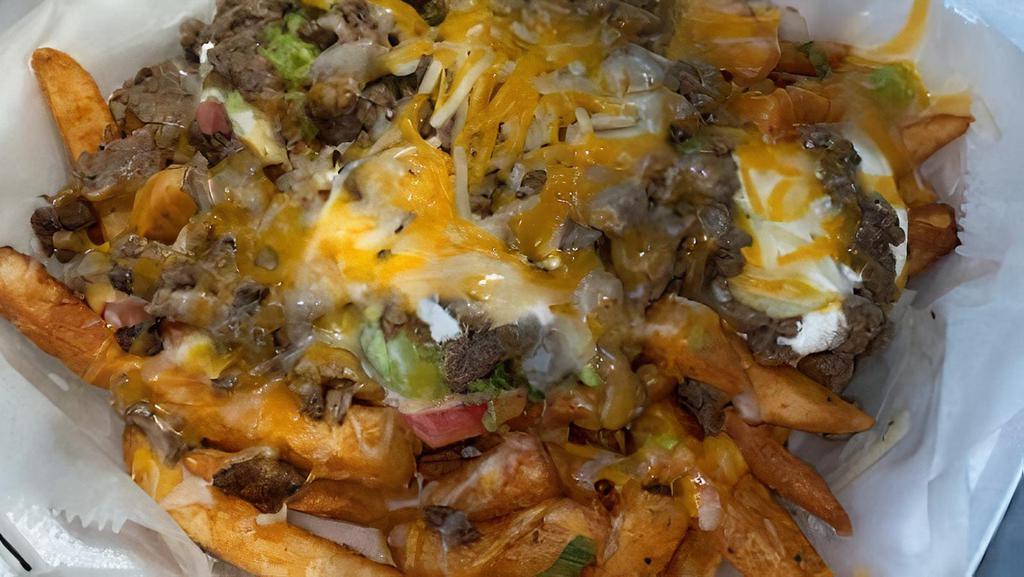Carne Asada Fries · French Fries topped with Carne Asada, cheese, Pico de Gallo, guacamole, and sour cream.