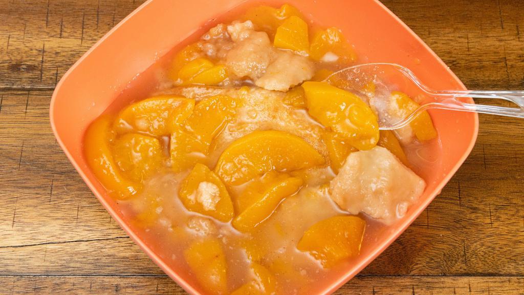 Peach Cobbler · Luscious peaches blanketed in a golden crust.