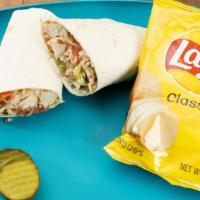 Chicken Wrap · Tender chicken, lettuce, diced tomatoes, and parmesan cheese wrapped in a tortilla - served ...