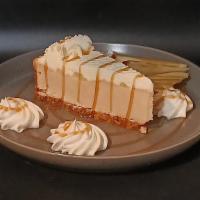 Caramel Apple Cheesecake · Graham cracker crust baked with caramel cheesecake & apple cubes. Topped with a green apple ...