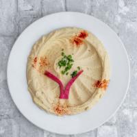 Hummus · Chickpeas blended with sesame seed sauce, garlic, and lemon.