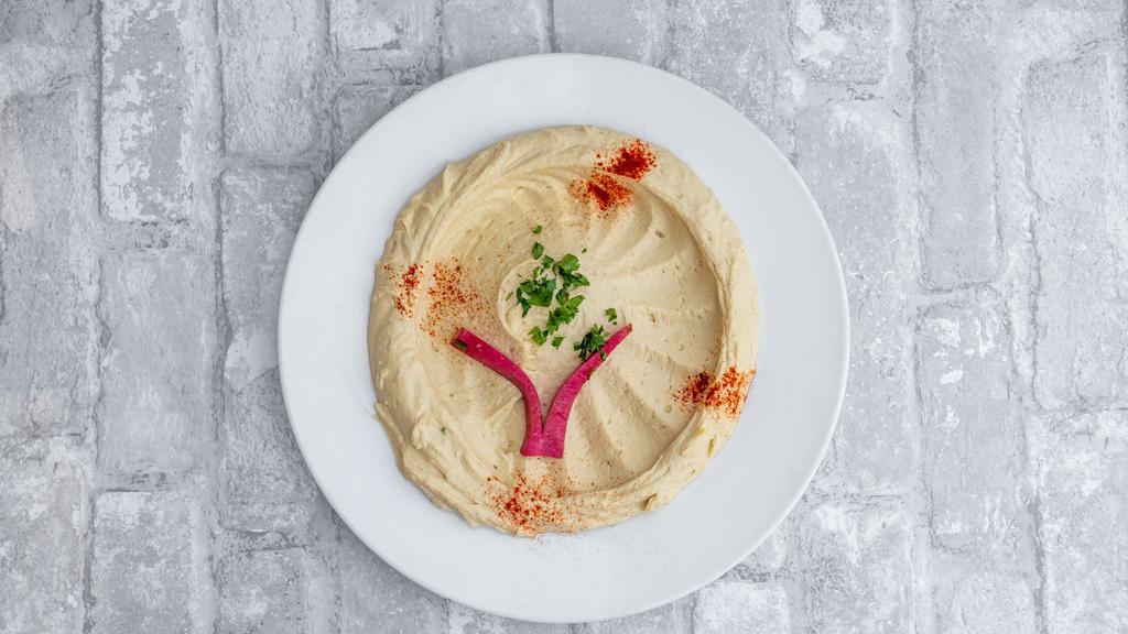Spicy Hummus · Spicy. Hummus mixed with jalapeño peppers and our spices blend.