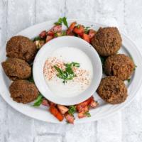 Falafel Plate · Chickpeas and fava beans ground with onions, parsley, cilantro, and spices. Served with tahi...