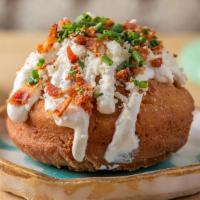Loaded Baked Potado-Nut · Tubers Donut with Sour Cream, Bacon, Chives , Cotija Cheese