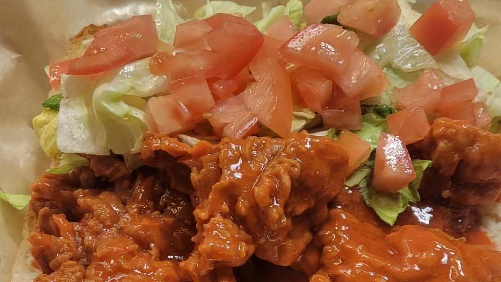 Crispy Buffalo Chicken Sandwich · Freshly breaded chicken breast tossed in buffalo sauce topped with lettuce and tomato