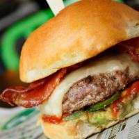 Bbq Bacon Burger · beef burger, white cheddar, bacon, fresh jalapeños, BBQ sauce & avocado spread