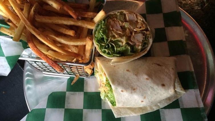 Shamrock Wrap · Grilled or crispy chicken wrapped in lettuce, tomato, onion, shredded cheddar cheese & shamrock sauce or substitute one of our signature wing sauces.