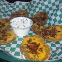 Loaded Potato Skins · Smothered with black bean and corn pico de gallo, bacon, and melted cheddar cheese. Drizzled...