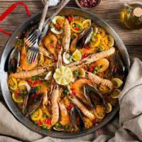 Paella · Served with rice, vegetables, and mixed seafood. It comes with two Sides of your choice