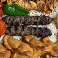 Veggie Combo · Hummus, Baba Ghanouj, Tabouleh, Veggie Grapeleaves, Fatayer Spinach, Rice