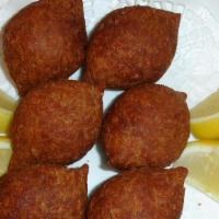 Fried Kebbe (5 Pcs) · Deep fried meat patty mixed with cracked wheat, stuffed with ground meat, onions and pine se...