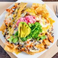 Red Chicken Nachos · Red chile marinated chicken, pickled red onions, black beans, Pepper Jack, white Cheddar, sa...