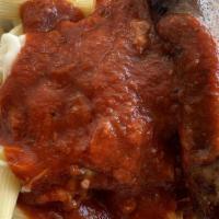 Hearty Homemade Mostaccioli With Italian Sausage · Our mostaccioli is cooked al-dente and covered with our homemade meat marinara sauce and top...