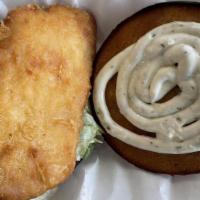 Fish Sandwich · Panko fried fish fillet with lettuce and tartar sauce on a toasted brioche bun.