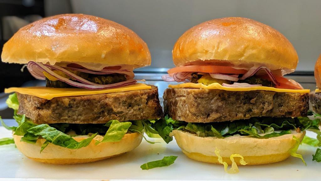 The Fang · Meatloaf, lettuce, tomato, red onion, pickles, American cheese, fang sauce on bun.