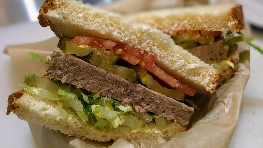 Joe Cool · Chilled meatloaf, lettuce, tomato, red onion, pickles, ketchup, white bread.