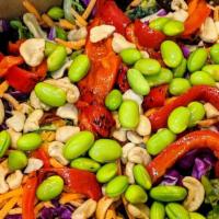 Asian Salad · Spring mix and kale, cabbage, edamame, cashews, roasted red peppers, carrots, sesame-ginger ...