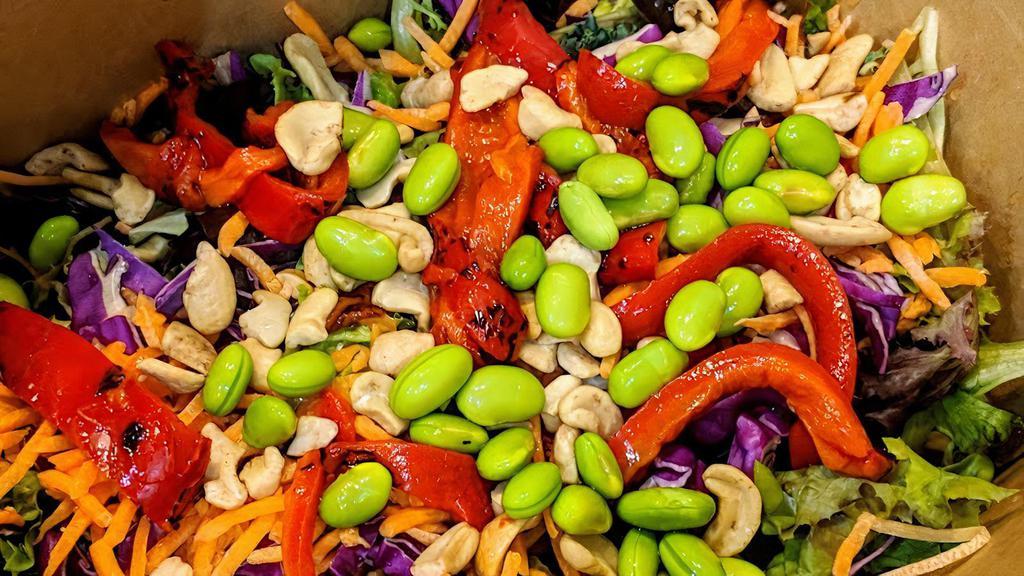 Asian Salad · Spring mix and kale, cabbage, edamame, cashews, roasted red peppers, carrots, sesame-ginger dressing.