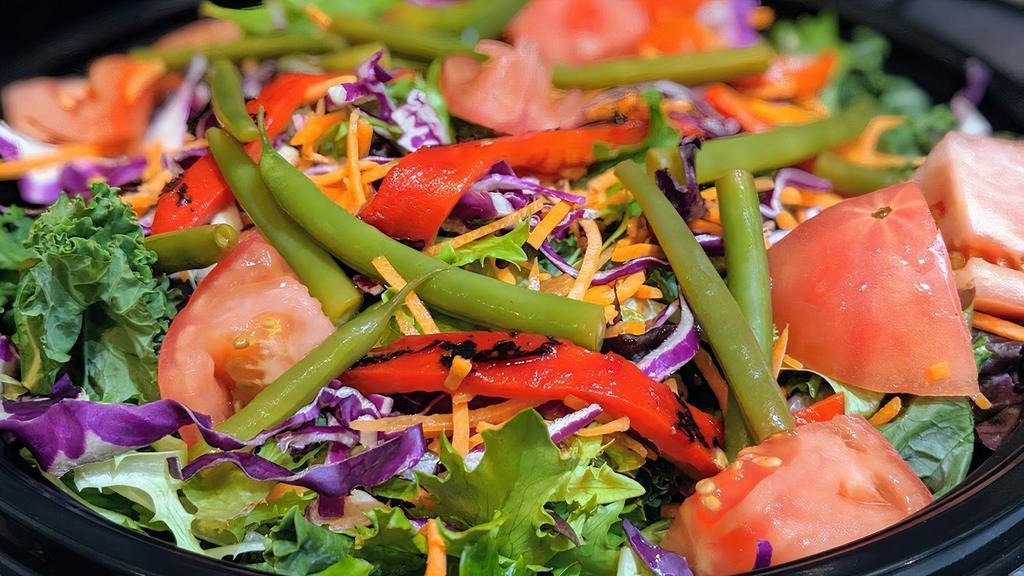Garden Salad · Spring mix and kale, tomato, red onion, pickled green beans, roasted red peppers, red cabbage, carrots, ranch dressing.
