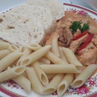 Chicken Paprikash / Kuře Na Paprice · Chicken pieces browned in olive oil, sautéed onions, sweet paprika.