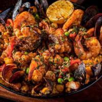 Paella Del Sur · Prawns, scallops, market fish, calamari, shrimp, saffron rice.