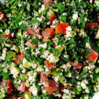 Tabbouleh Salad · Chopped parsley, onions, and tomatoes with cracked wheat.