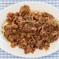 House Beef · Spicy. Sliced beef sautéed in garlic sauce with black pepper, garnished with shredded cabbage.