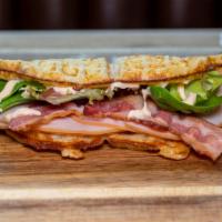 Turkey Chipotle Club · Turkey, bacon & mixed greens drizzled with chipotle mayo