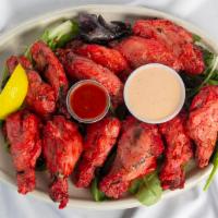 Chicken Wings (12 Pcs) · Contains dairy, mild. Wing’s cooked in tandoor (clay oven).
