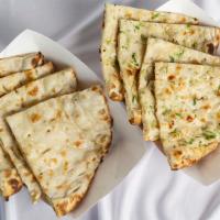 Butter Naan · Fresh made. Leavened bread baked in a tandoor (clay oven).