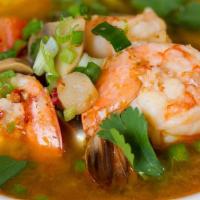Tom Yum · Hot and sour soup with straw mushrooms, tomatoes, seasoned with lemongrass, citrus leaves an...