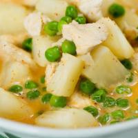 Mild Curry · Traditional yellow Thai curry simmered in coconut milk with potato and green peas.