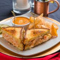 Lobster Grilled Cheese · Lobster, dill havarti cheese, roasted garlic aioli on Texas toast served with Palmino sauce ...